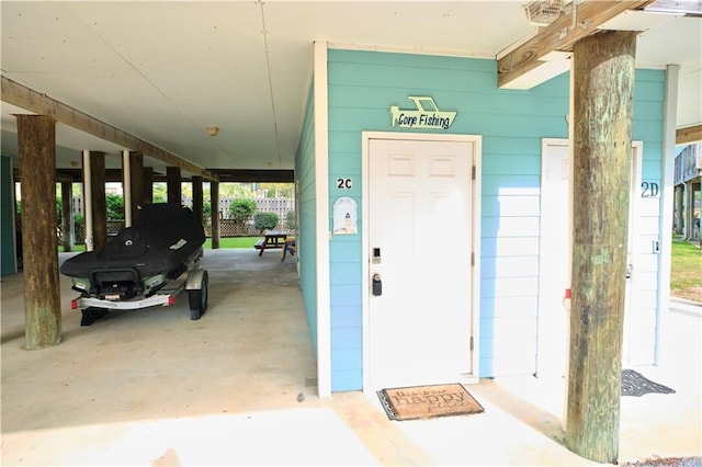 property entrance featuring a carport