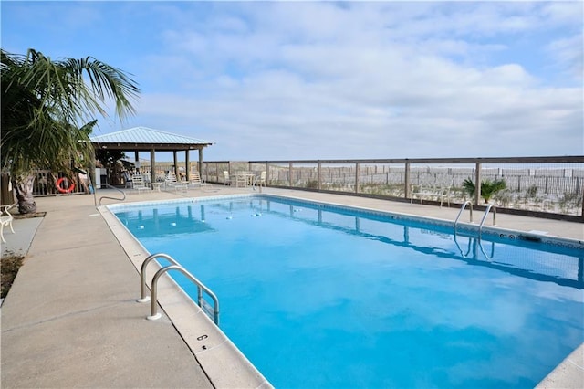 view of pool featuring a gazebo and a patio