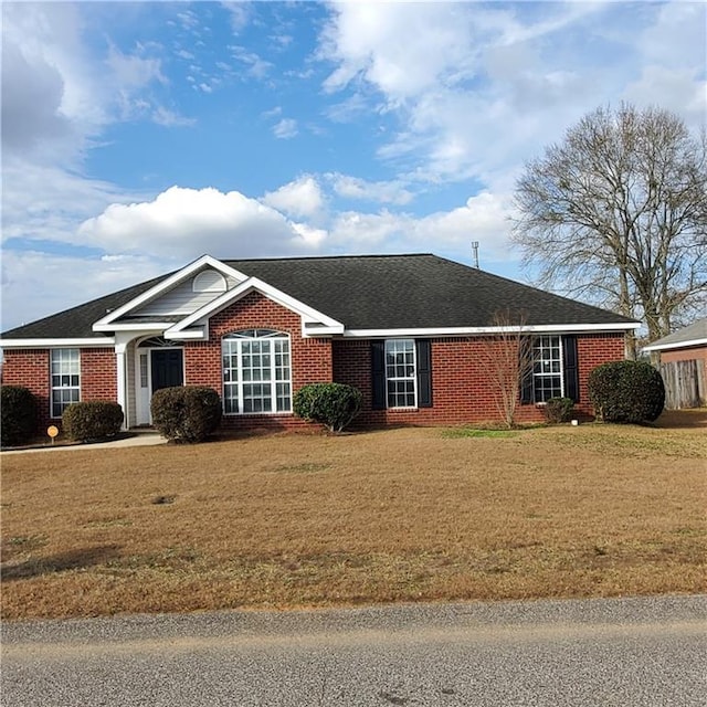 ranch-style house with a front yard