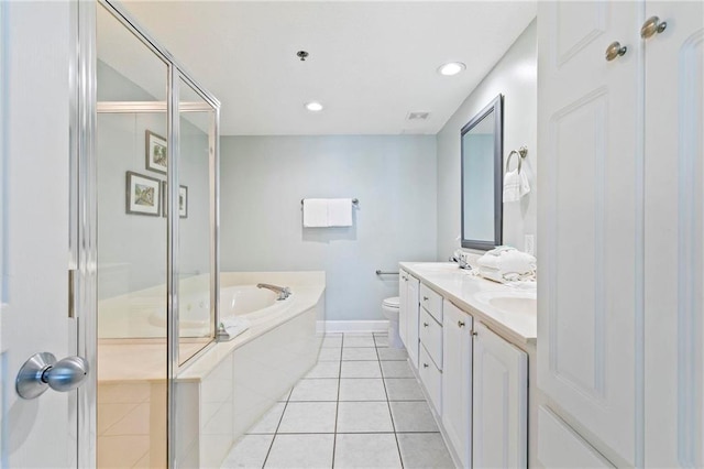 full bathroom with tile patterned floors, vanity, independent shower and bath, and toilet