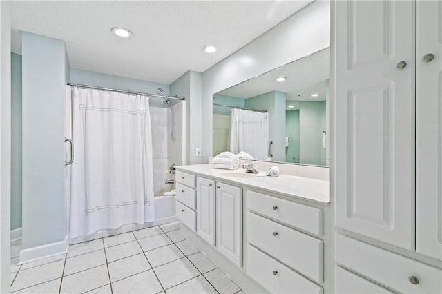 bathroom featuring shower / bathtub combination with curtain, tile patterned flooring, and vanity