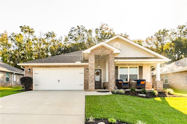 view of front of home with a garage and a front lawn