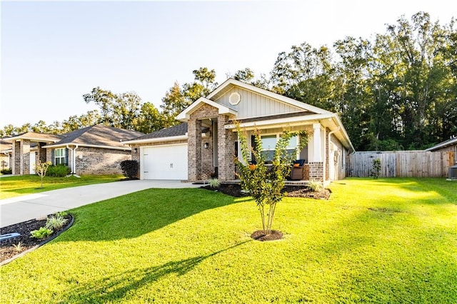 ranch-style house with cooling unit, a front lawn, and a garage