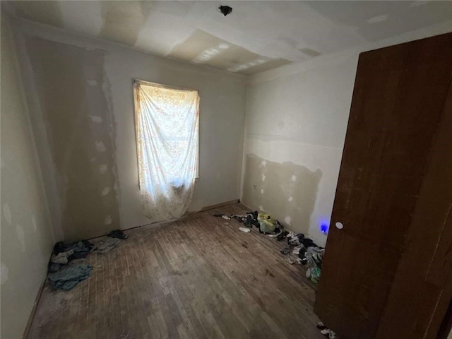 spare room featuring wood finished floors