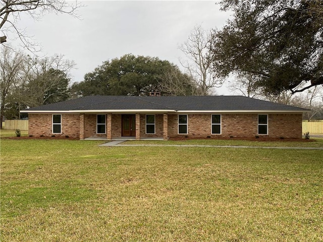 ranch-style house with brick siding and a front lawn