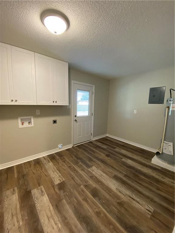 laundry area featuring dark wood-style floors, hookup for a washing machine, cabinet space, hookup for an electric dryer, and baseboards