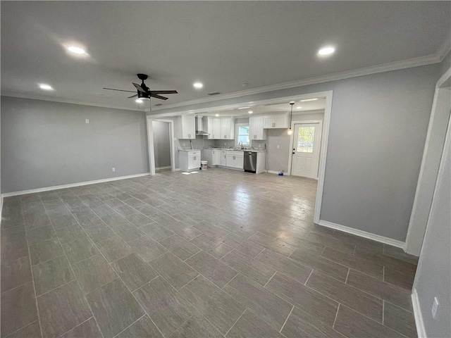 unfurnished living room featuring crown molding and ceiling fan