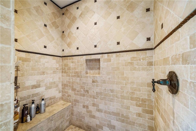 bathroom featuring tiled shower