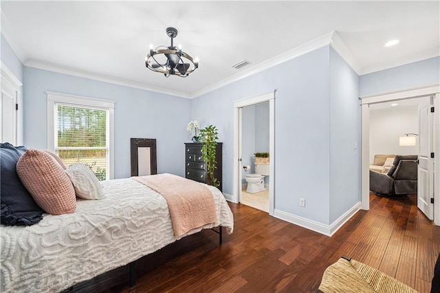 bedroom featuring ornamental molding, dark hardwood / wood-style floors, connected bathroom, and a notable chandelier