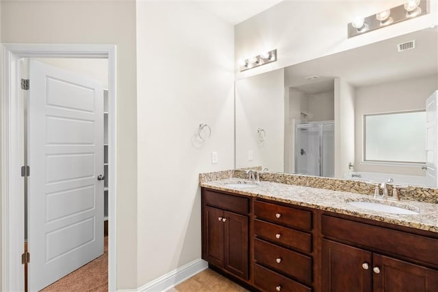 bathroom featuring vanity and walk in shower