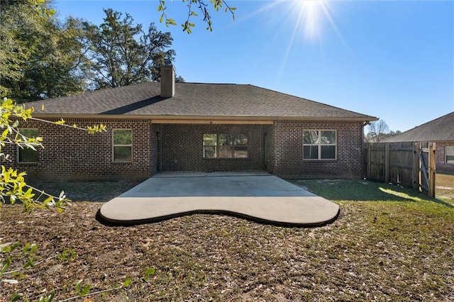 back of property with a patio