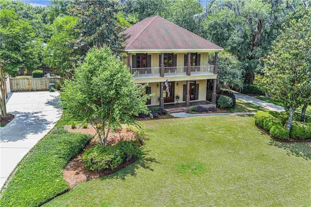 6400 Harbor Place Dr, Daphne, AL 36526 - view of front of property featuring fence, a balcony, a front yard, a porch, and driveway