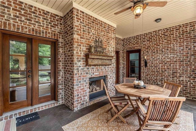 6400 Harbor Place Dr, Daphne, AL 36526 - dining space with crown molding, brick wall, wood ceiling, french doors, and a ceiling fan