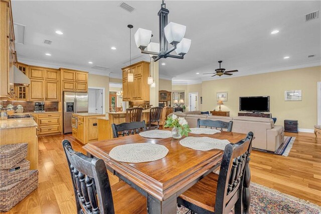 6400 Harbor Place Dr, Daphne, AL 36526 - dining room with crown molding, recessed lighting, ceiling fan with notable chandelier, and visible vents