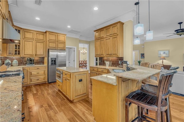 6400 Harbor Place Dr, Daphne, AL 36526 - kitchen featuring crown molding, light stone countertops, a sink, under cabinet range hood, and stainless steel refrigerator with ice dispenser