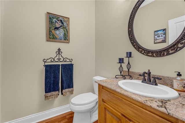 6400 Harbor Place Dr, Daphne, AL 36526 - half bath featuring vanity, wood finished floors, and toilet