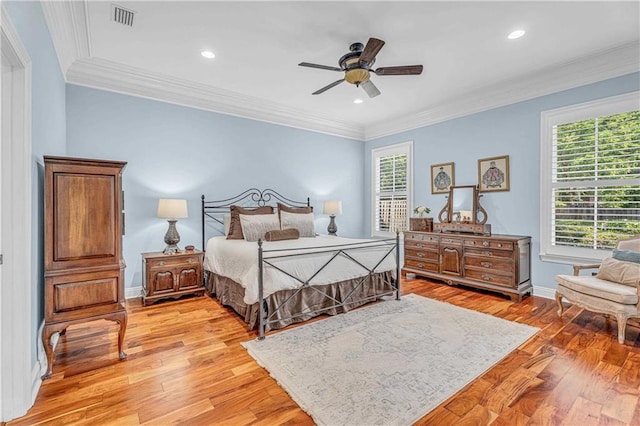 6400 Harbor Place Dr, Daphne, AL 36526 - bedroom with visible vents, ornamental molding, light wood finished floors, and multiple windows