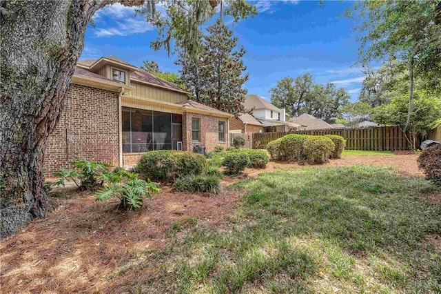 6400 Harbor Place Dr, Daphne, AL 36526 - view of yard with fence and a sunroom