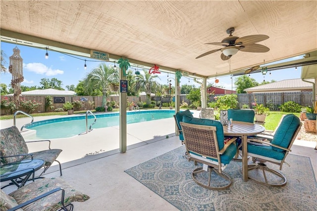 view of swimming pool with a patio area and ceiling fan