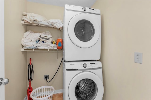 1801 Bienville Blvd Unit 213, Dauphin Island, AL 36528 - laundry room featuring stacked washer / drying machine
