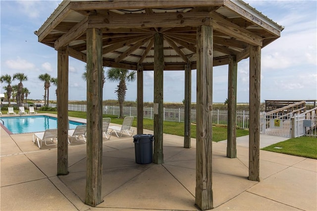 1801 Bienville Blvd Unit 213, Dauphin Island, AL 36528 - view of community featuring a patio area, a pool, and a gazebo
