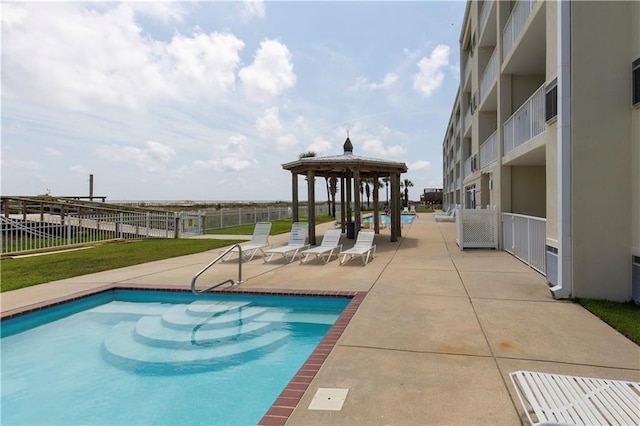 1801 Bienville Blvd Unit 213, Dauphin Island, AL 36528 - community pool featuring a gazebo and a patio area