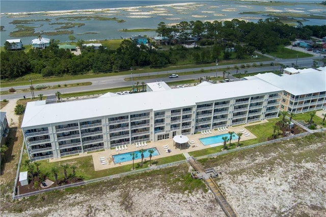 1801 Bienville Blvd Unit 213, Dauphin Island, AL 36528 - drone / aerial view of a pool, apartment complex / building, and a large body of water