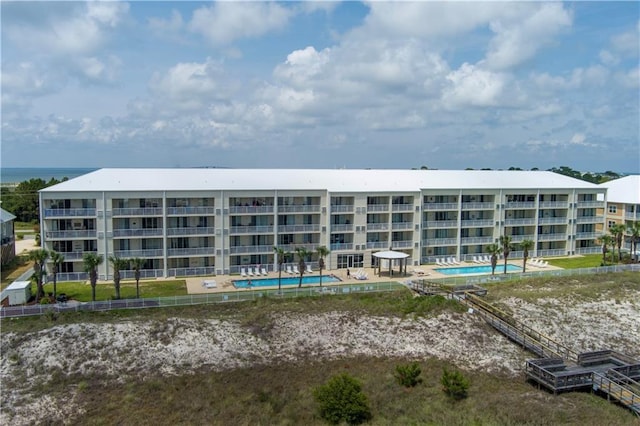 1801 Bienville Blvd Unit 213, Dauphin Island, AL 36528 - view of apartment building / complex with a community pool