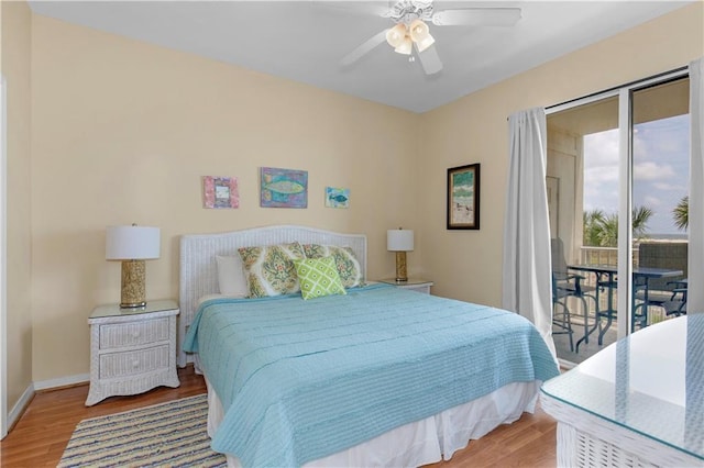 1801 Bienville Blvd Unit 213, Dauphin Island, AL 36528 - bedroom featuring access to outside, wood finished floors, baseboards, and a ceiling fan