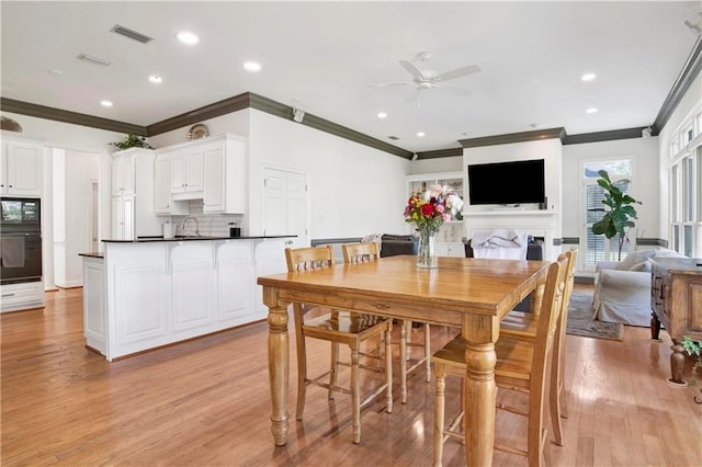 dining area with ceiling fan, recessed lighting, visible vents, and light wood-style floors