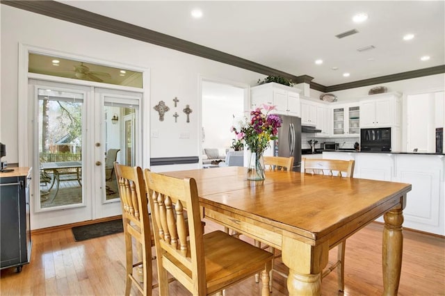 dining space featuring recessed lighting, visible vents, light wood-style floors, french doors, and ornamental molding