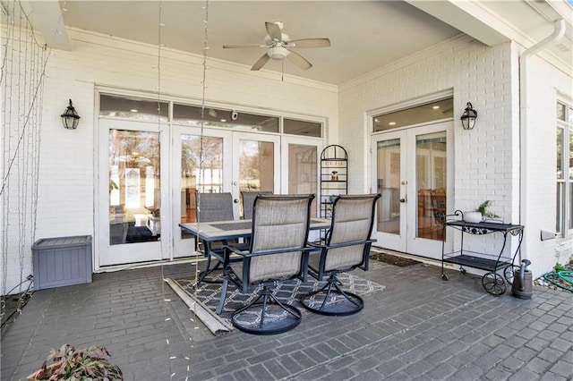 view of patio featuring ceiling fan and french doors