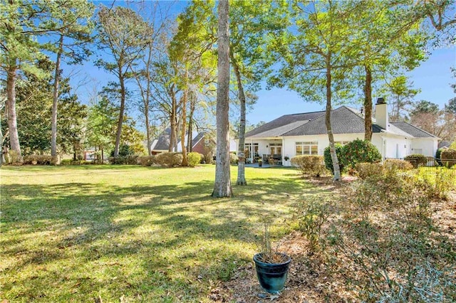 view of yard featuring an attached garage