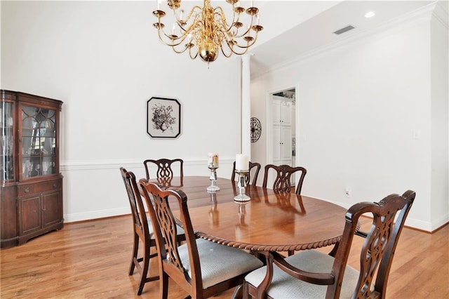 dining room featuring recessed lighting, visible vents, baseboards, ornamental molding, and light wood finished floors