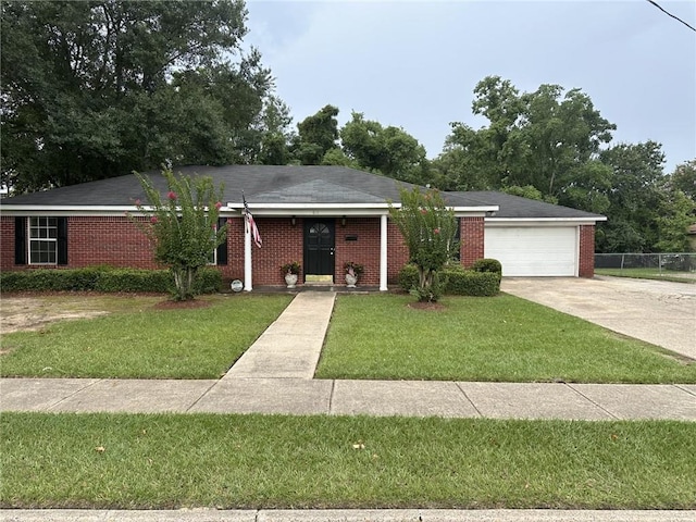 ranch-style house with a garage and a front yard