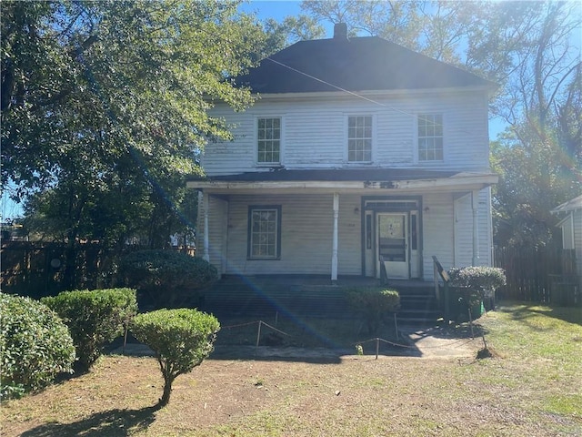 view of front of home featuring a front lawn and a porch