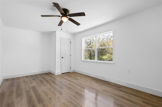 3158 Lees Ln, Mobile, AL 36693 - empty room featuring baseboards, a ceiling fan, and wood finished floors
