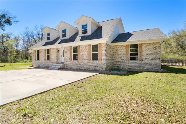 3158 Lees Ln, Mobile, AL 36693 - new england style home with a front yard, brick siding, crawl space, and fence
