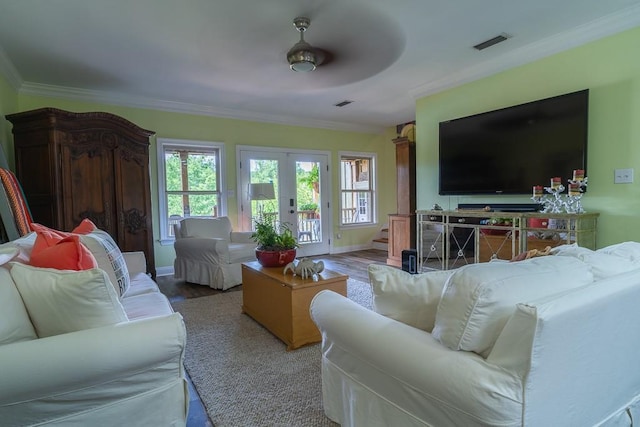 living room with french doors, light hardwood / wood-style floors, ceiling fan, and crown molding