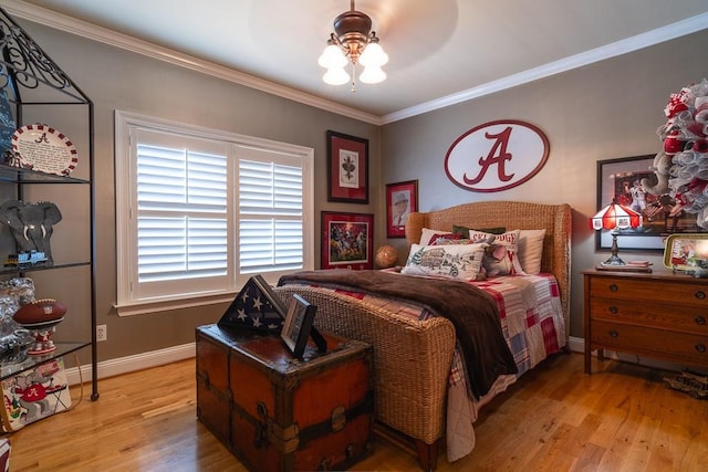 bedroom with ceiling fan, light hardwood / wood-style flooring, and ornamental molding