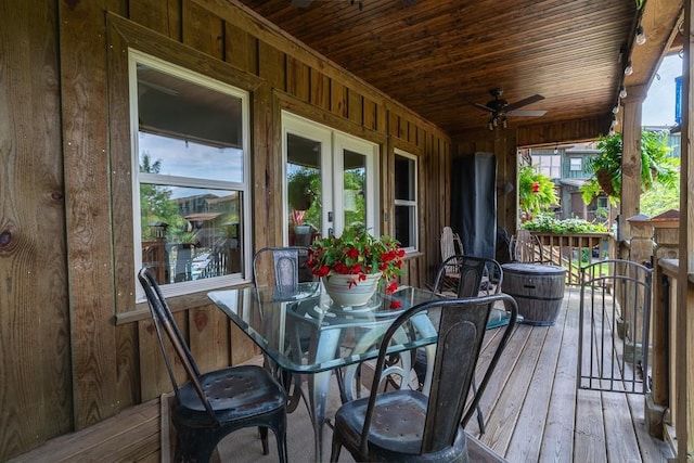 wooden terrace with ceiling fan and french doors