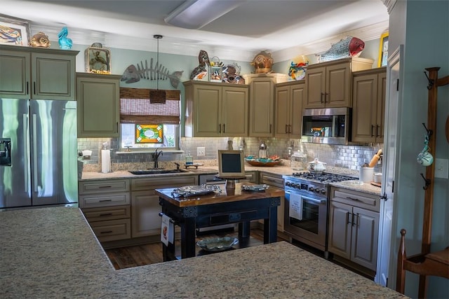 kitchen with decorative backsplash, decorative light fixtures, stainless steel appliances, and sink