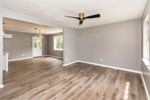 unfurnished room with wood-type flooring and ceiling fan