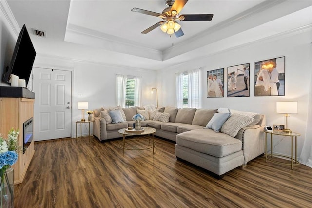 1411 Creola Axis Loop Rd, Axis, AL 36505 - living room featuring dark wood-style floors, ceiling fan, a raised ceiling, and crown molding