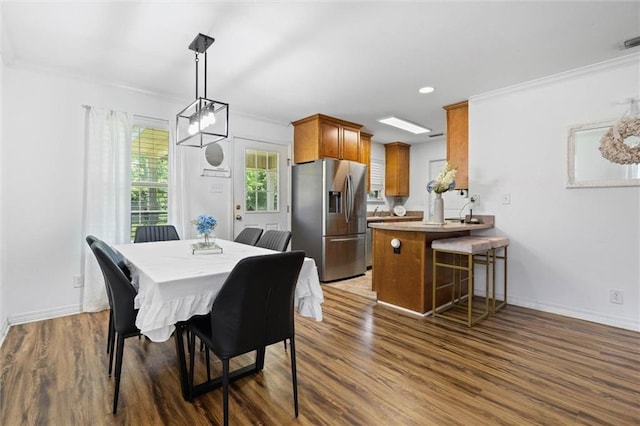 1411 Creola Axis Loop Rd, Axis, AL 36505 - dining area with dark wood finished floors, crown molding, baseboards, and recessed lighting