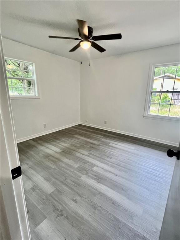 3905 Charmaine Cir E, Mobile, AL 36605 - spare room featuring a ceiling fan, baseboards, and dark wood-style floors
