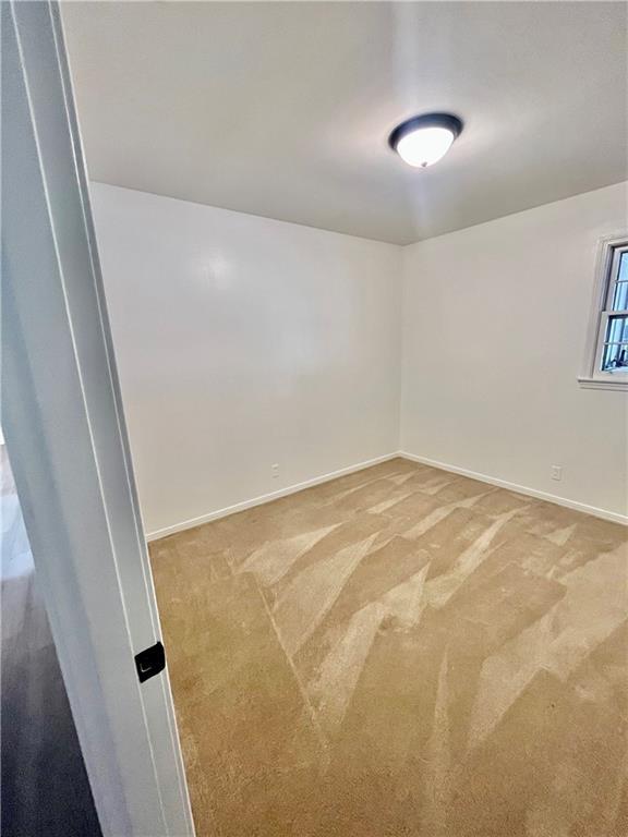 3905 Charmaine Cir E, Mobile, AL 36605 - spare room featuring light carpet and baseboards