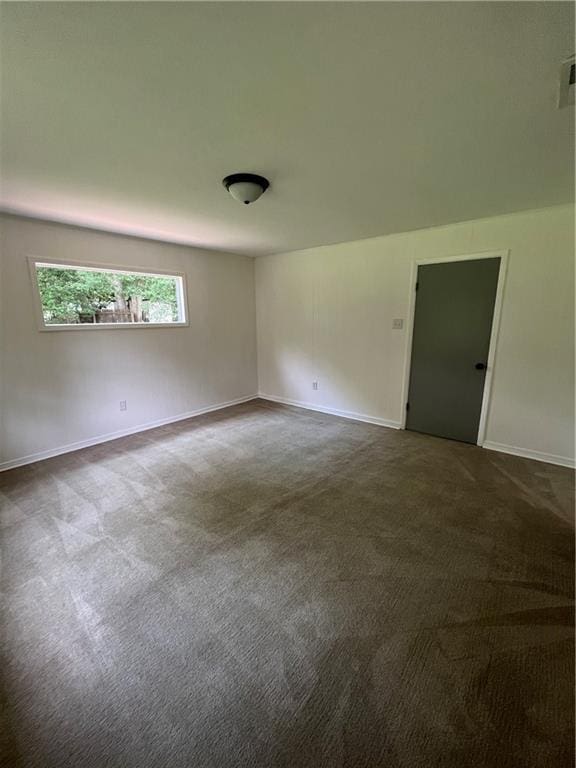 3905 Charmaine Cir E, Mobile, AL 36605 - spare room with dark carpet and baseboards