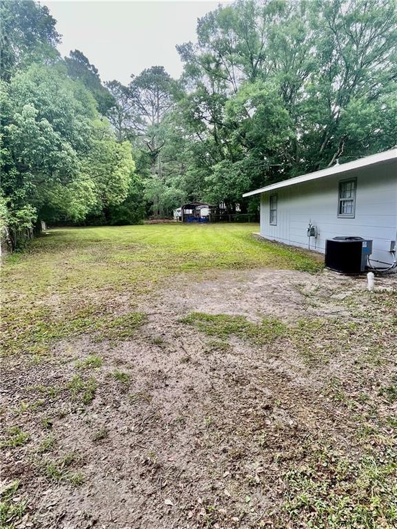 3905 Charmaine Cir E, Mobile, AL 36605 - view of yard featuring central AC