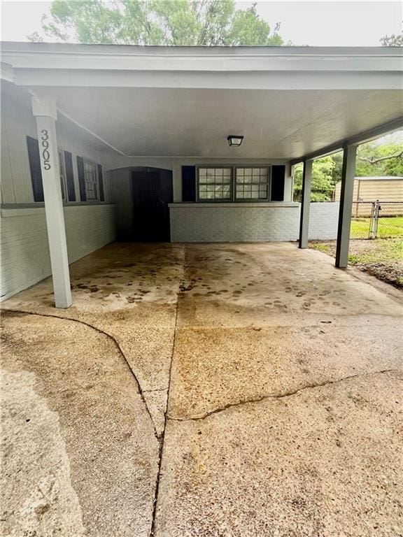 3905 Charmaine Cir E, Mobile, AL 36605 - view of patio / terrace with a carport and fence